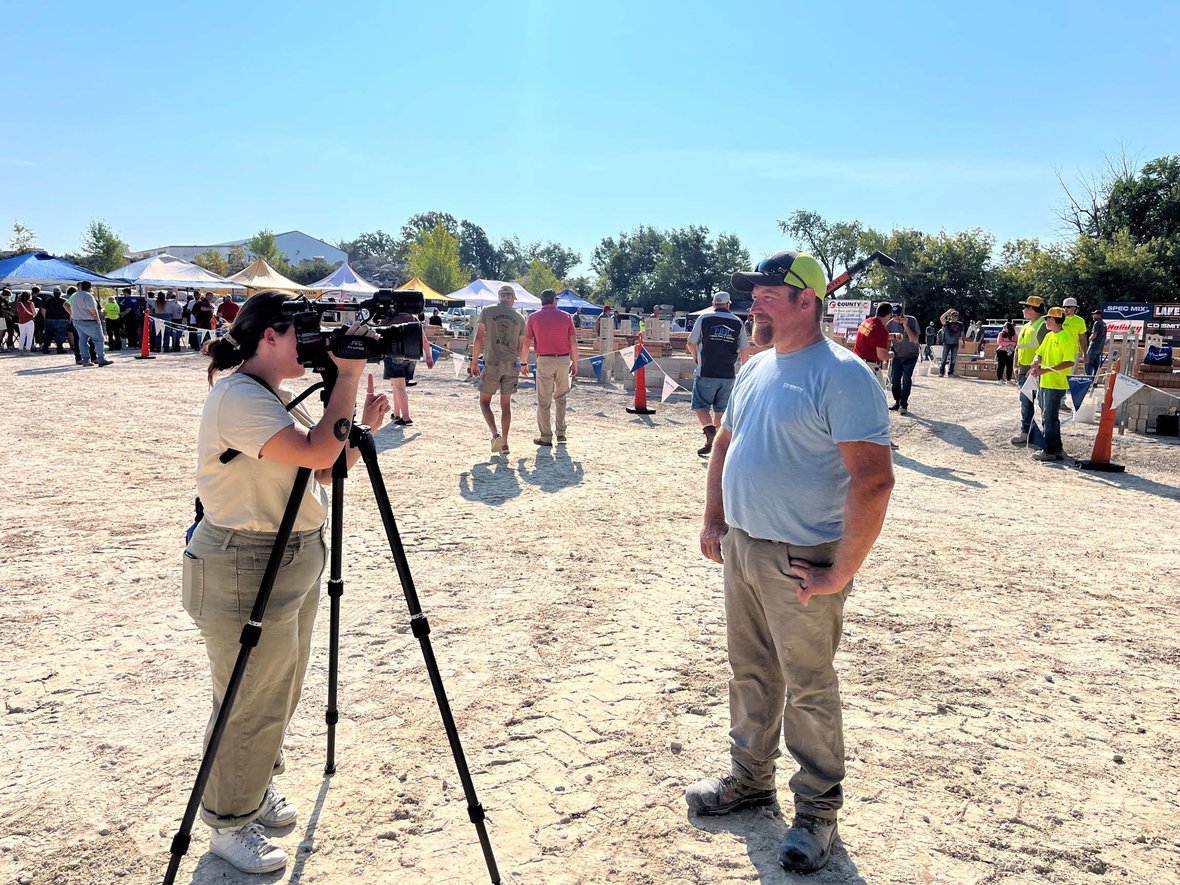 Mason interviewed on camera at the 2025 Spec Mix Bricklayer 500 regional event in Fond du Lac.