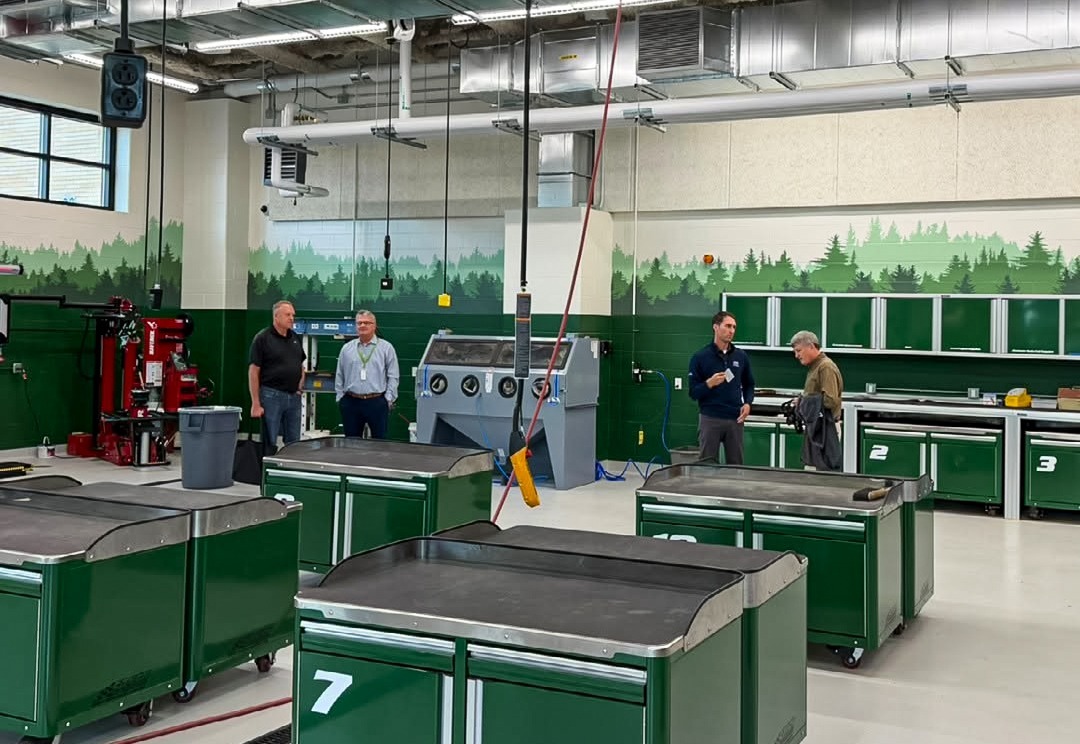 Completed auto lab with numbered tool carts and a tire changer at Rhinelander High School.