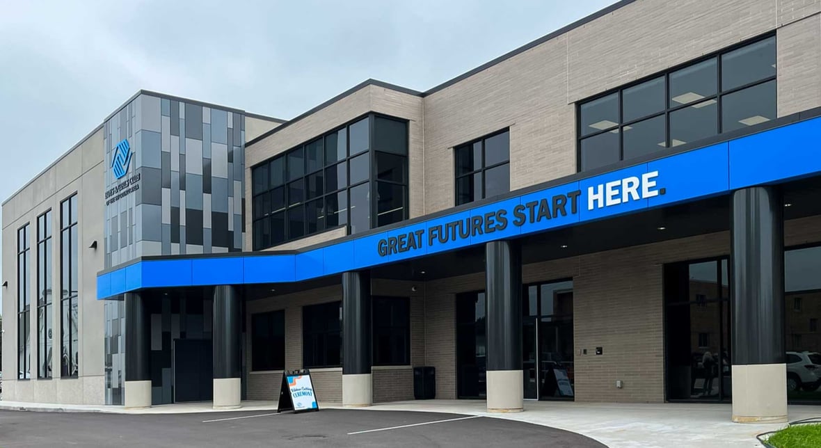 Exterior view of the Ripon Boys &amp; Girls Club of the Tri-County Area featuring blue “Great Futures Start Here” canopy in downtown Ripon, Wisconsin.