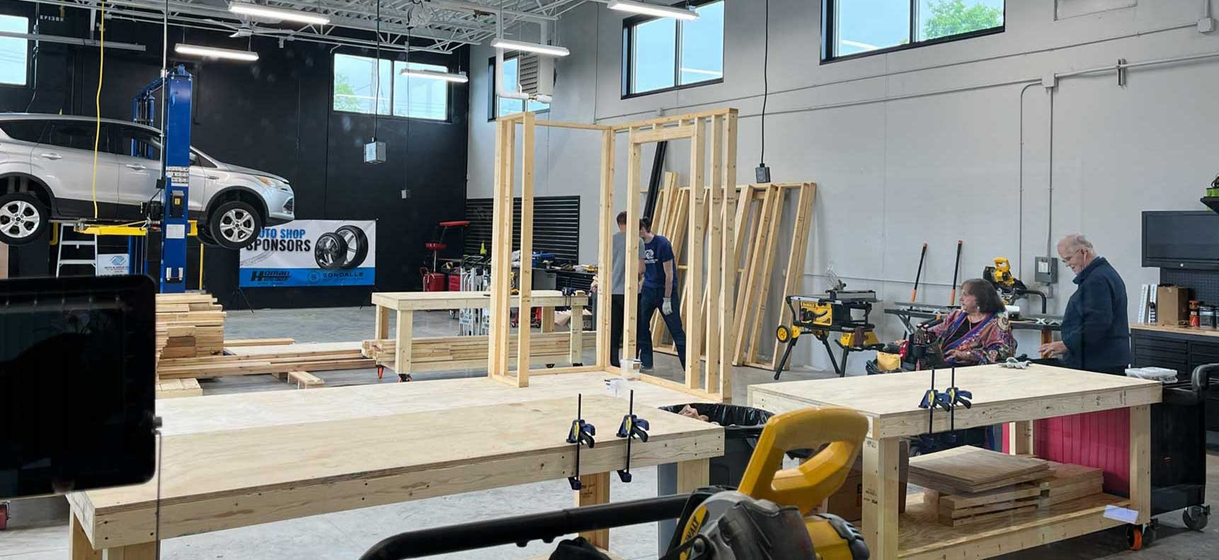 Youth skilled trades workshop at the Ripon Boys & Girls Club with framing stations auto lift and hands-on training environment