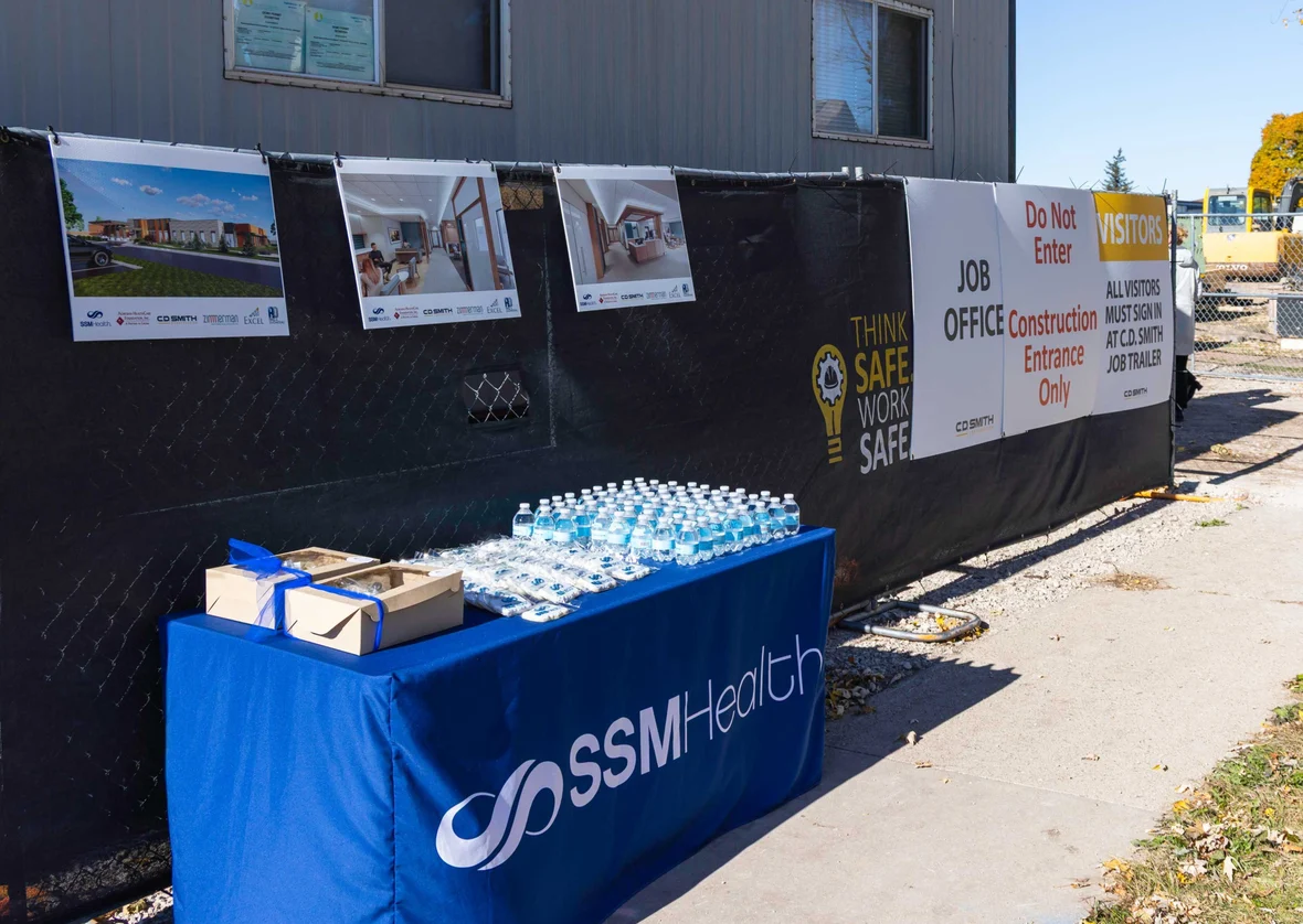 Renderings and project information displayed at the SSM Health Cancer Center expansion groundbreaking event.