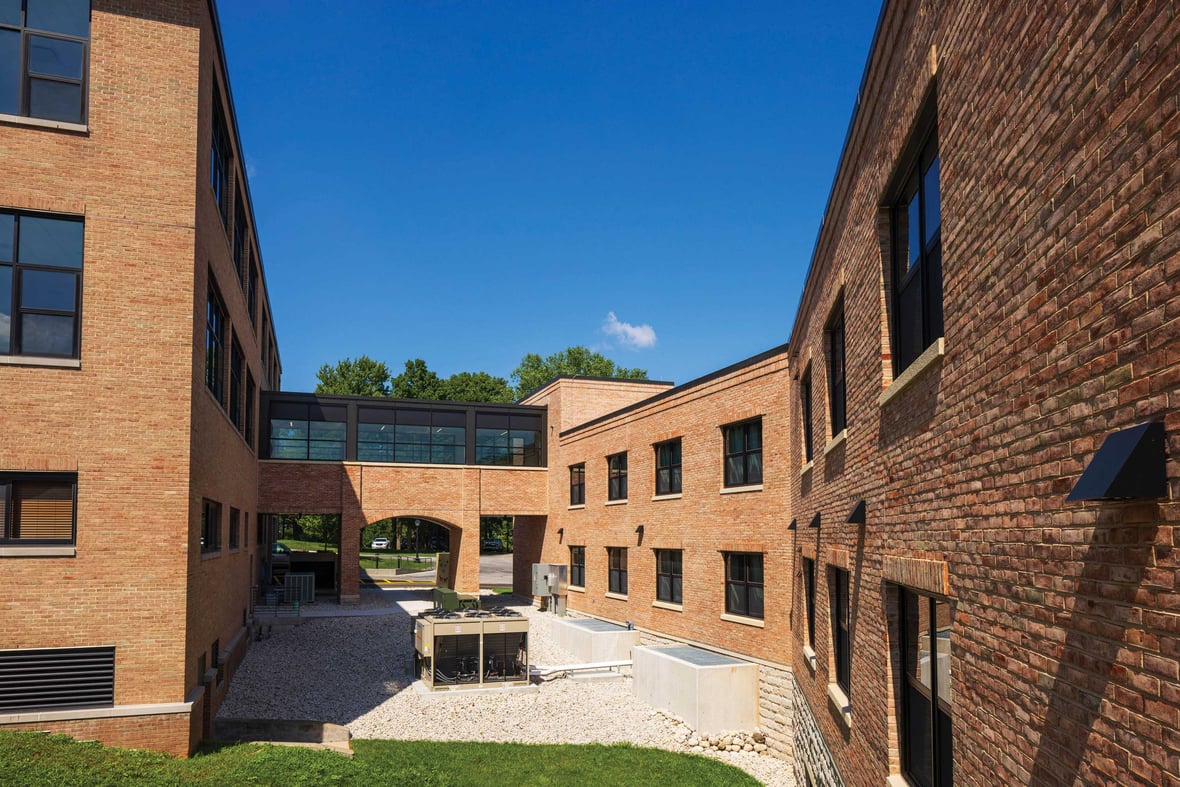 Brick campus buildings connected by an enclosed walkway at St. Lawrence Seminary in Mount Calvary Wisconsin