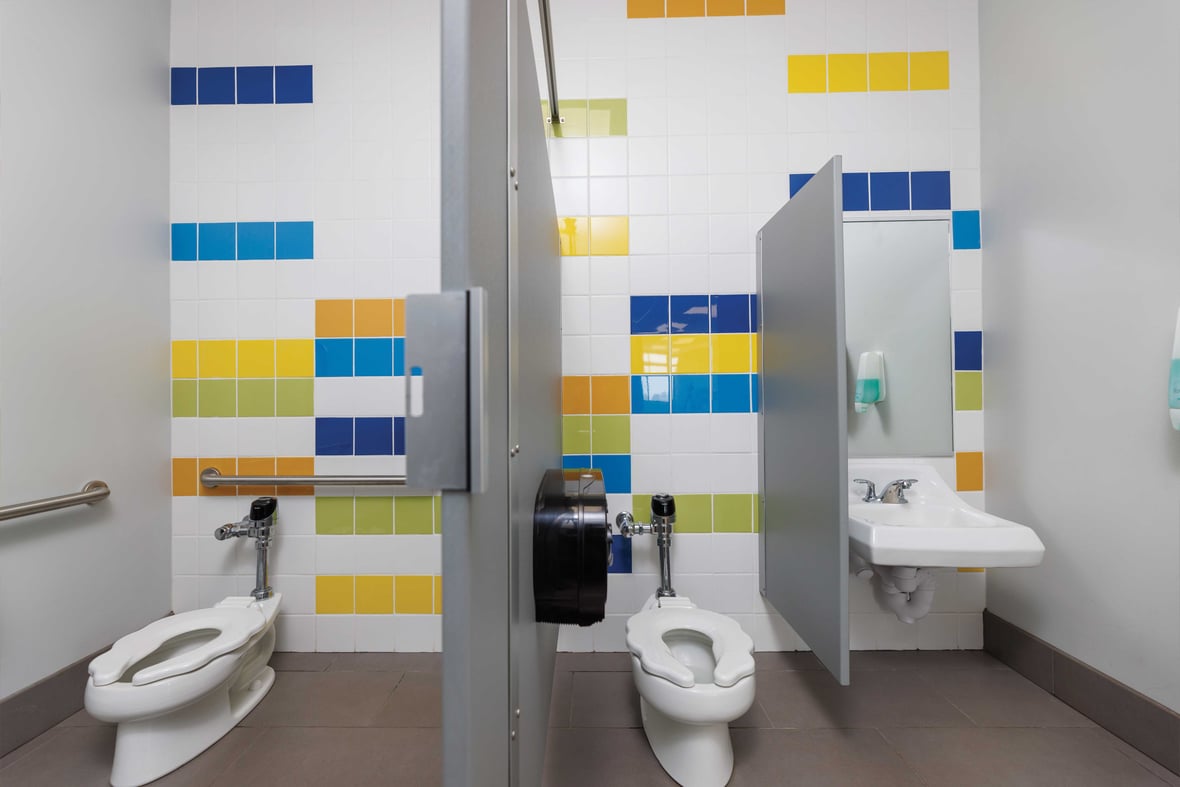Child-friendly restroom with colorful tile walls designed for independence