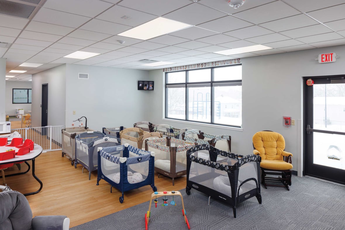Crib area designed for infant nap time at St. Matthews child care addition