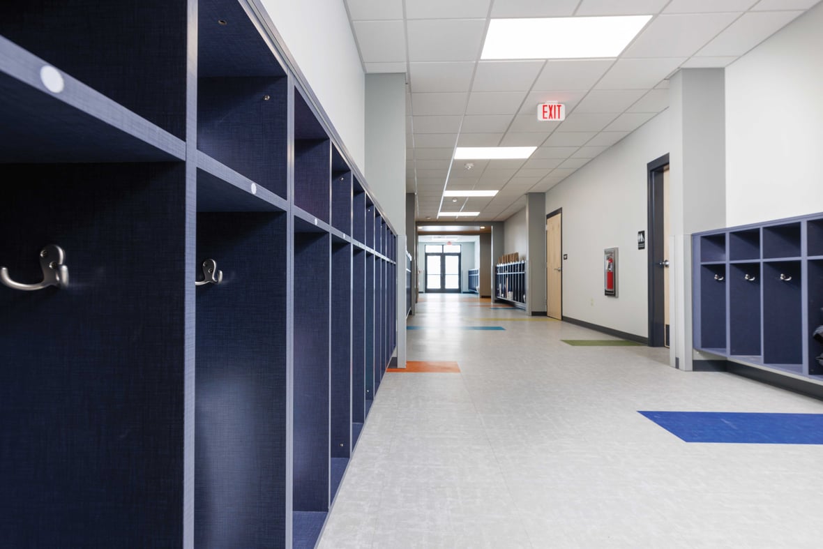 Extended hallway with cubbies and hooks for student storage at St. Matthews