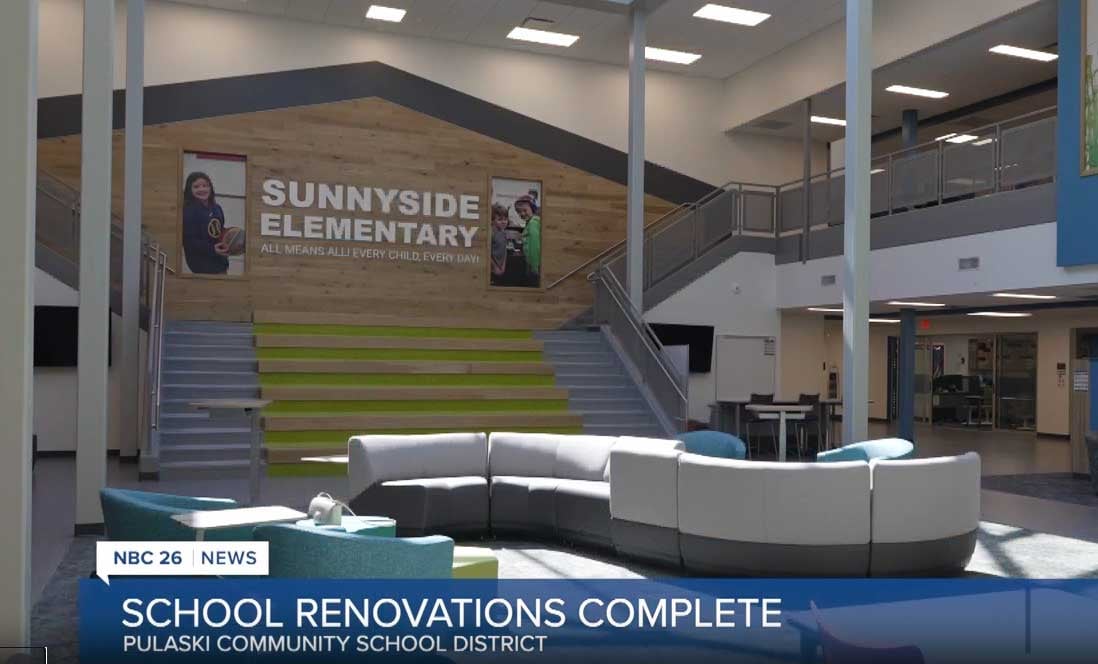 Interior view of Sunnyside Elementary’s renovated commons area, featuring natural light, open hallways, and flexible seating designed for collaborative learning.