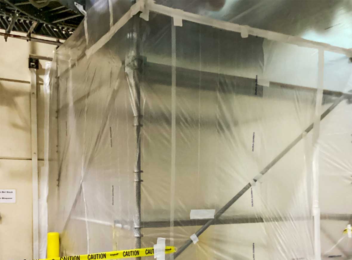 Nearly 30-foot temporary containment wall protecting active production areas during construction at the Campbell Snacks Franklin facility.