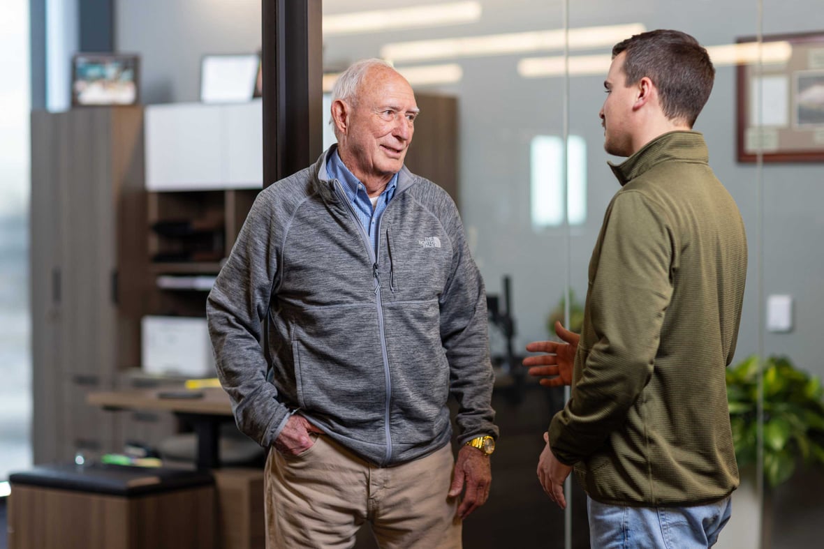 Tom Baker Sr. Chairman of the Board in conversation with Project Manager Marc McGuire at C.D. Smith Construction headquarters in Fond du Lac Wisconsin.