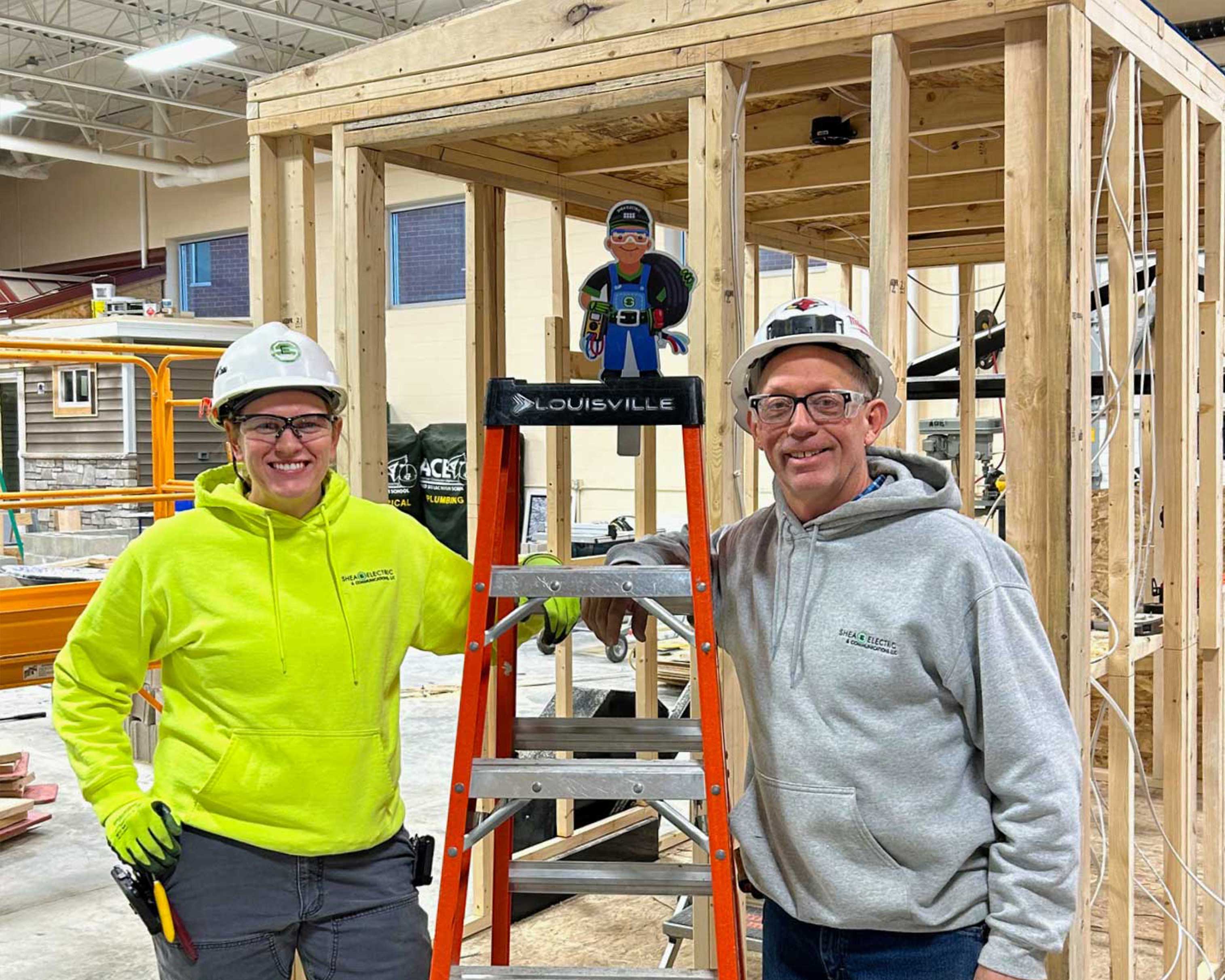 C.D. Smith Construction Building School Partnerships Fond du Lac High School Teacher with rep working on ACE Shanty Project for Construction and Skilled Trades Career and Technical Education